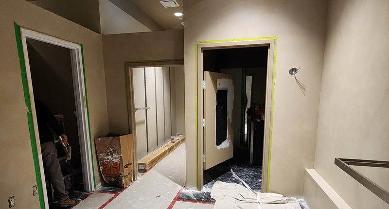 Interior strip-out with taped floor protection and containment in place
