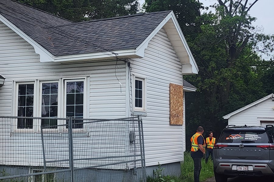 AtlantCare crew boarding up a fire-damaged house