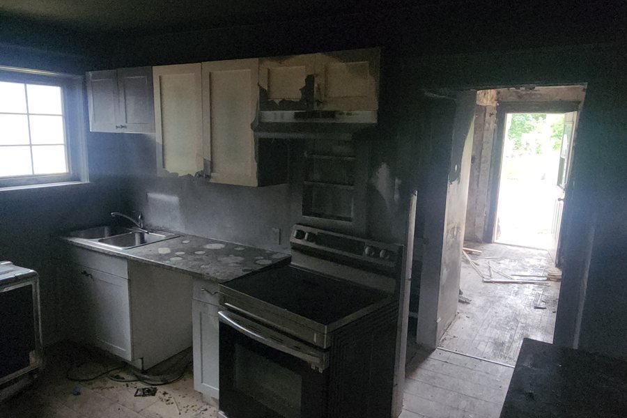 Smoke-damaged kitchen being documented for the insurance claim