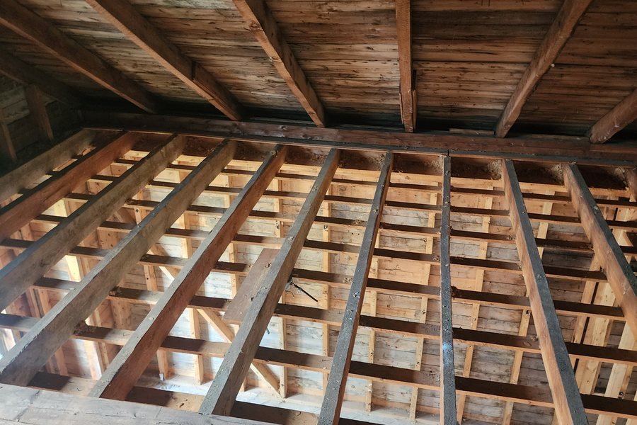 Ceiling and floor structure exposed after a controlled strip-out