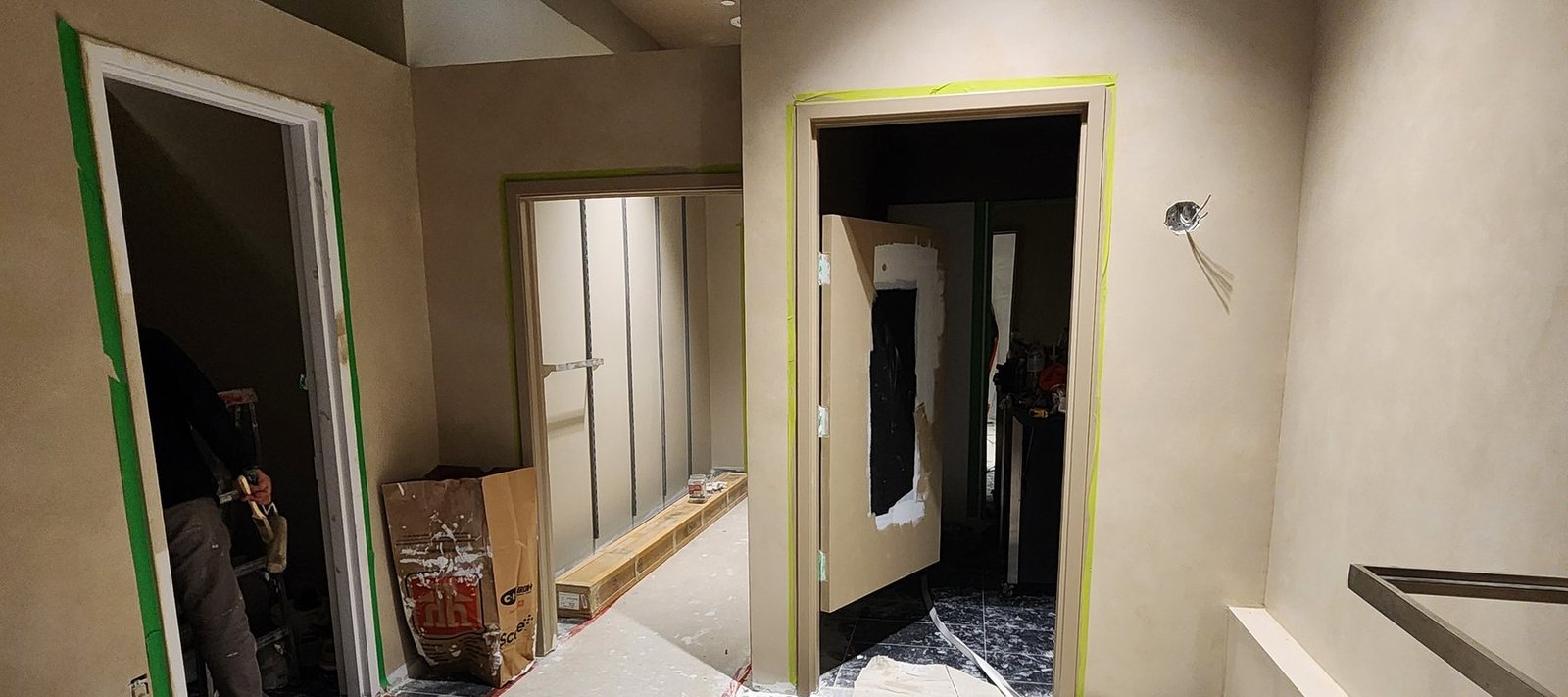 Interior strip-out with taped floor protection and containment in place